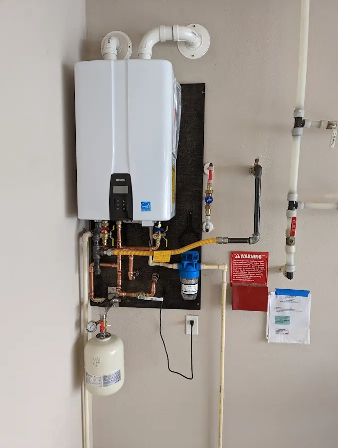 Professional plumber installing copper piping in a Florence home